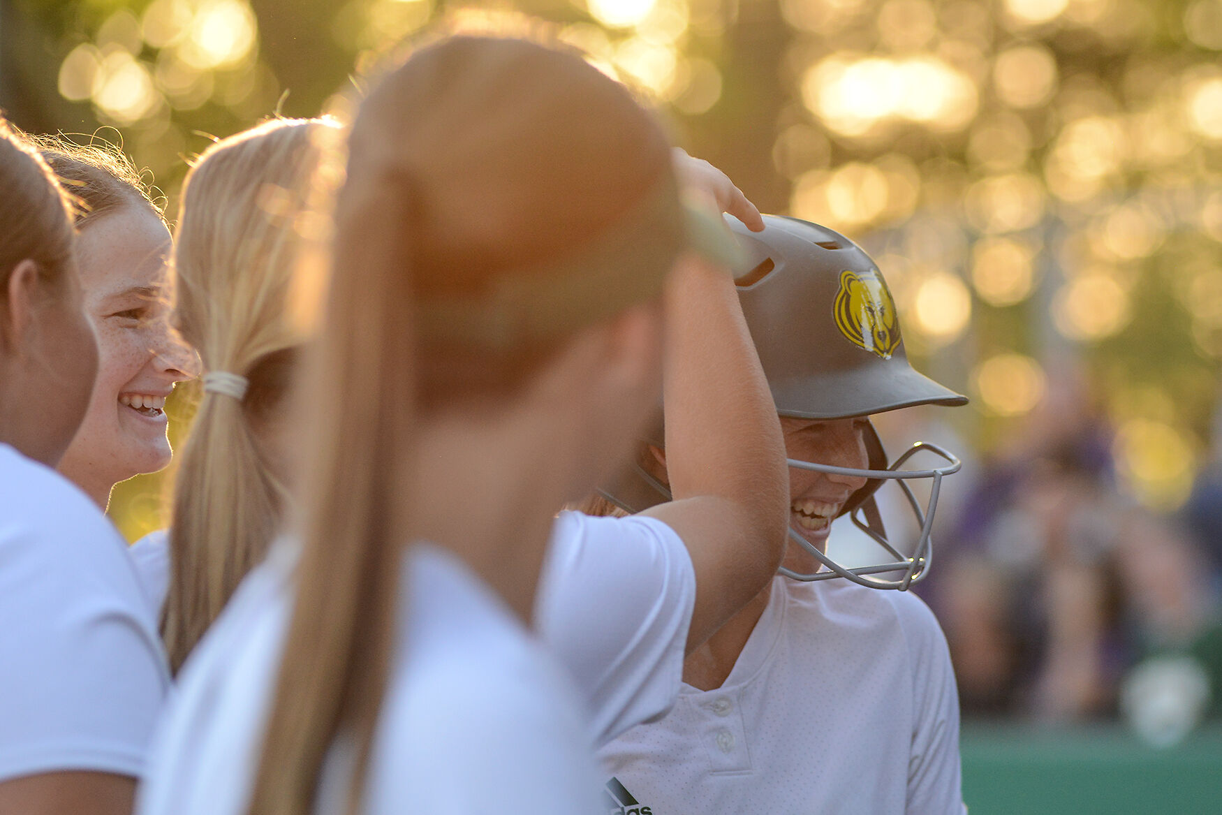 Cydney Fullerton celebrates with her Rock Bridge teammates after scoring a home run